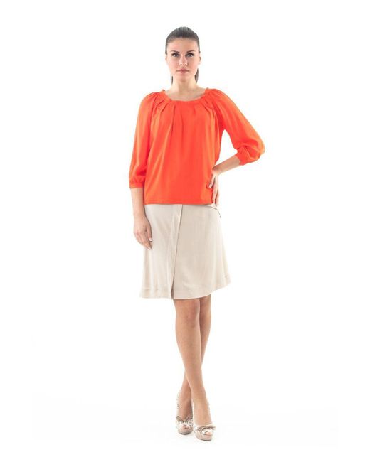Conquista Orange Ruffle Neck Top