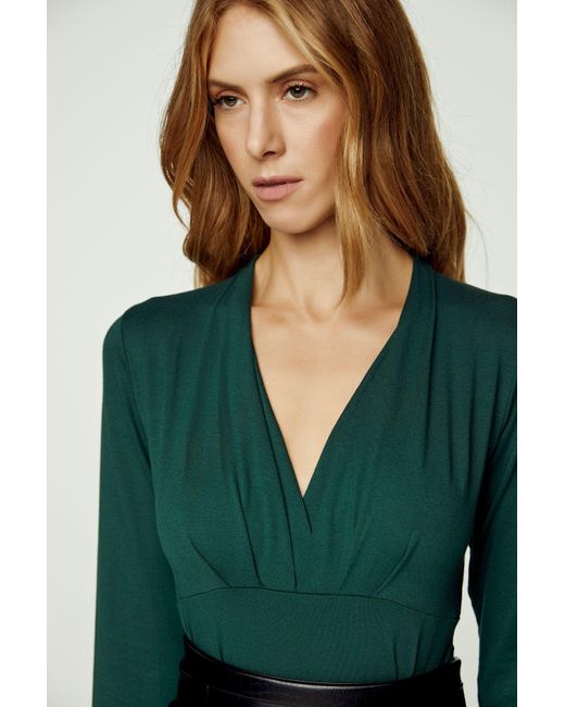 Conquista Green Long Sleeve Faux Wrap Top In Stretch Jersey Sustainable Fabric