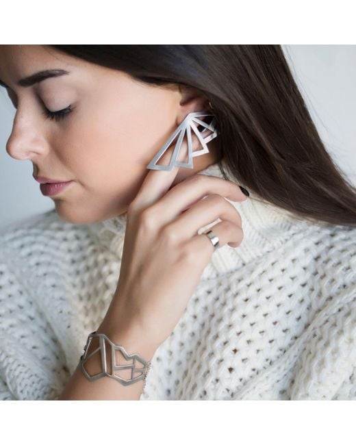LINYA JEWELLERY White Asymmetrical Earrings
