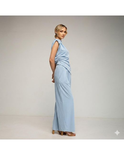 Tantra Spain Sl Blue Set Of Straight Trousers And Side Pockets. Short Sleeve Top With Asymmetrical Length