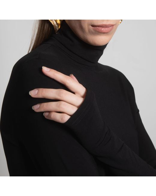 Una Berzina Black Turtleneck
