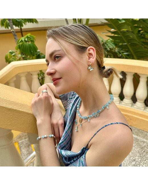 Farra Metallic Aquamarine Charms With A Butterfly Pendant Necklace