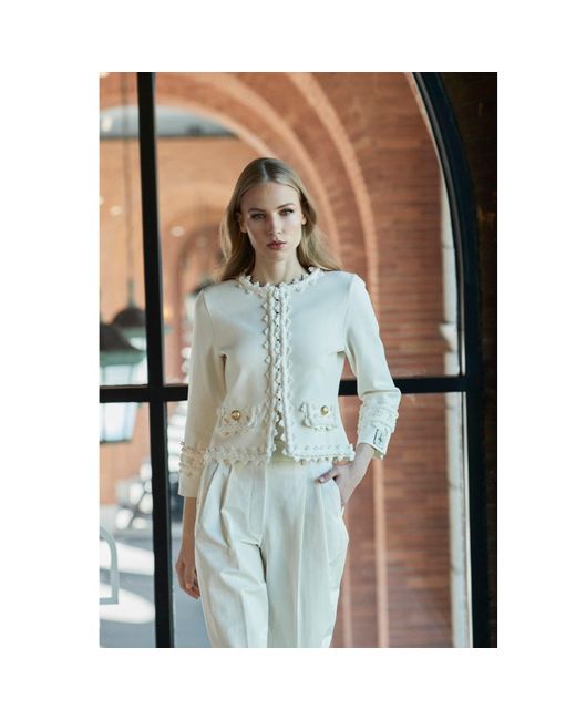 The Extreme Collection White Ivory Cropped Jacket With Textured Floral Embellishments And-Tone Buttons René
