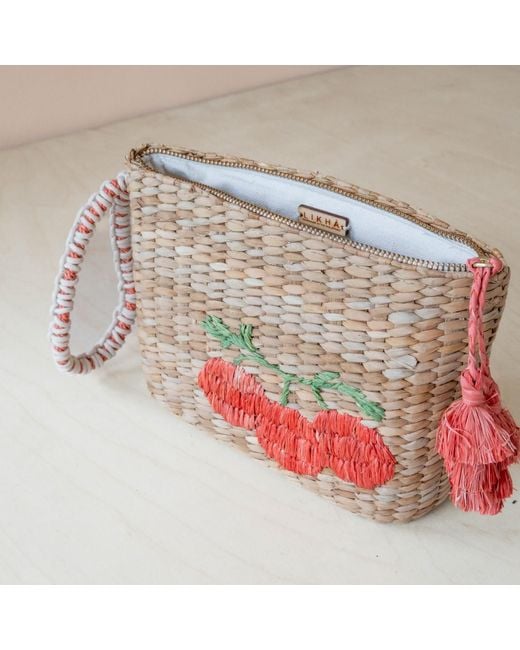 LIKHÂ Red Neutrals Handwoven Seagrass Tomato Wristlet Pouch With Tassels