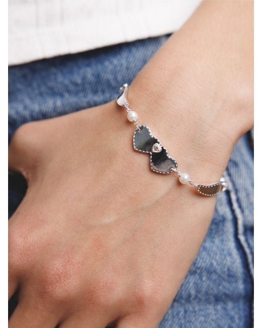 Déclarer Metallic Wings Of Love Bracelet