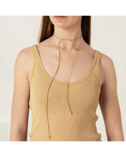 EVA REMENYI Metallic Neutrals Origin Bow Sand Necklace