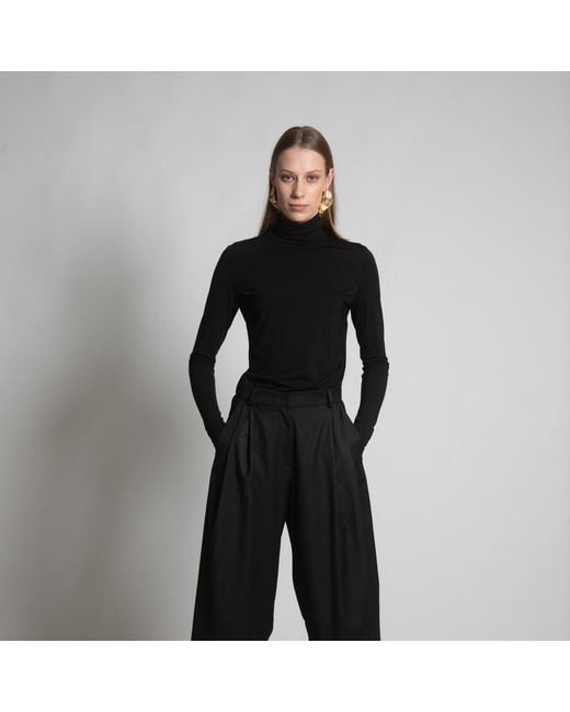 Una Berzina Black Turtleneck