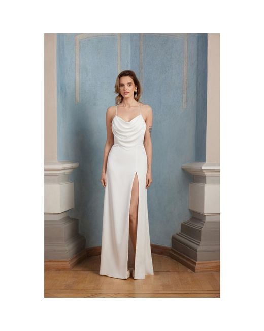Nomi Fame White Aphrodite Draped Cowl Neck Evening Gown With Slit And Crossed Straps