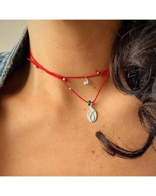The Pheia Metallic String Fish Necklace