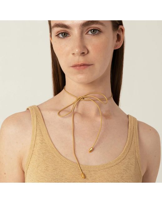 EVA REMENYI Metallic Neutrals Origin Bow Sand Necklace