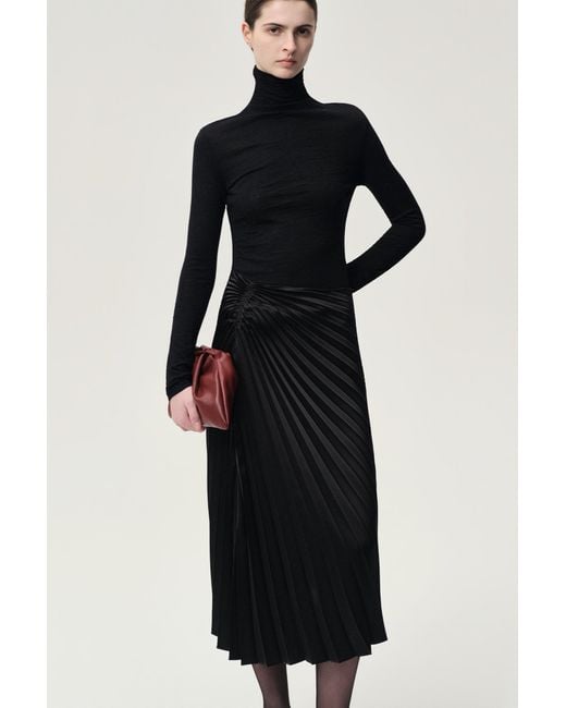 FRONT ROW SHOP Blue Open-Back Wool Jersey Top
