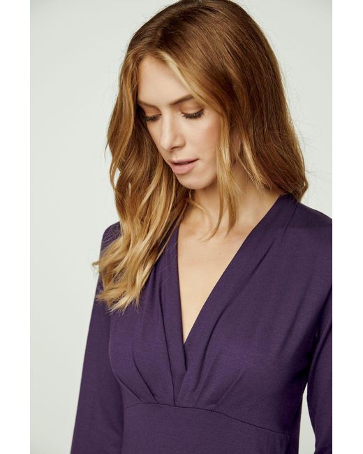 Conquista Blue Ink Long Sleeve Faux Wrap Top