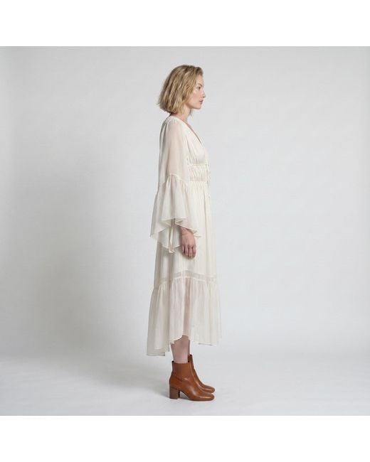 Modenaire White Vacation Style Ruffle Sleeve Maxi Dress With Plunging Neck & Tie Waist