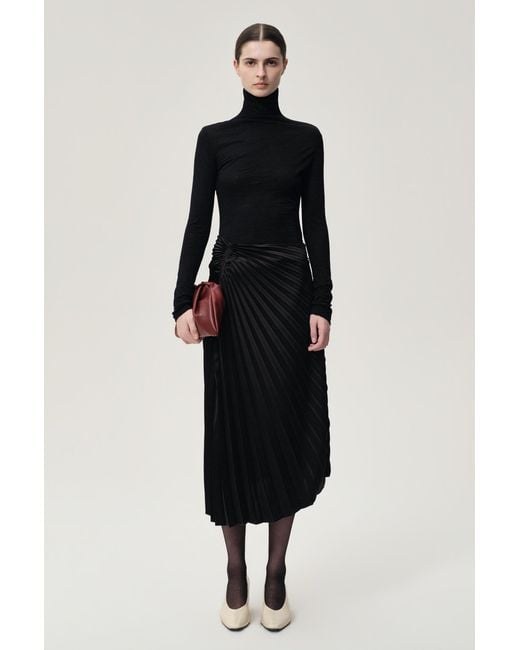 FRONT ROW SHOP Blue Open-Back Wool Jersey Top