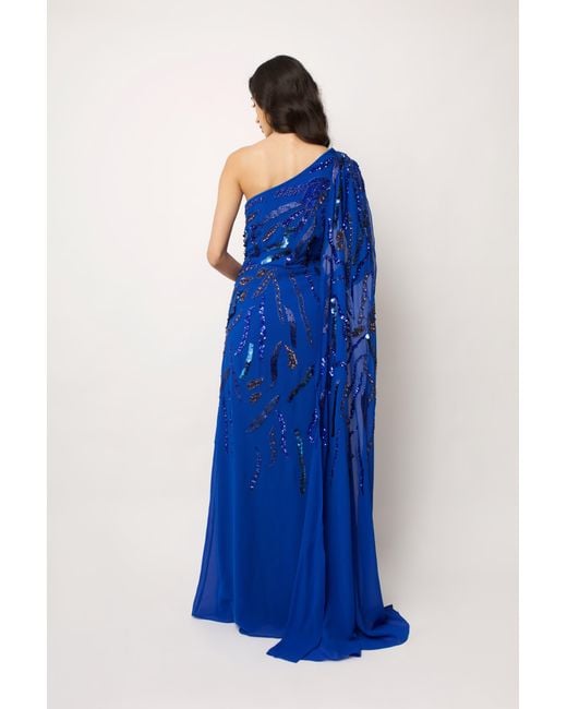 Raishma Blue Astrid A One Shoulder With A Dramatic To-The-Floor Draped Georgette Train, Falling From The Shoulder Gown