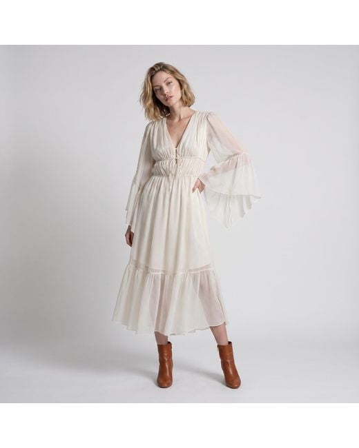 Modenaire White Vacation Style Ruffle Sleeve Maxi Dress With Plunging Neck & Tie Waist