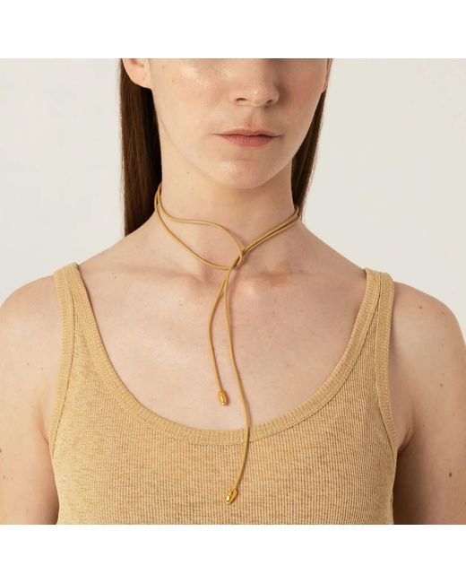 EVA REMENYI Metallic Neutrals Origin Bow Sand Necklace