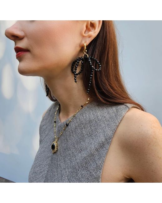 Farra Metallic Obsidian Crafted Butterfly Knot And Tassel Asymmetric Earrings