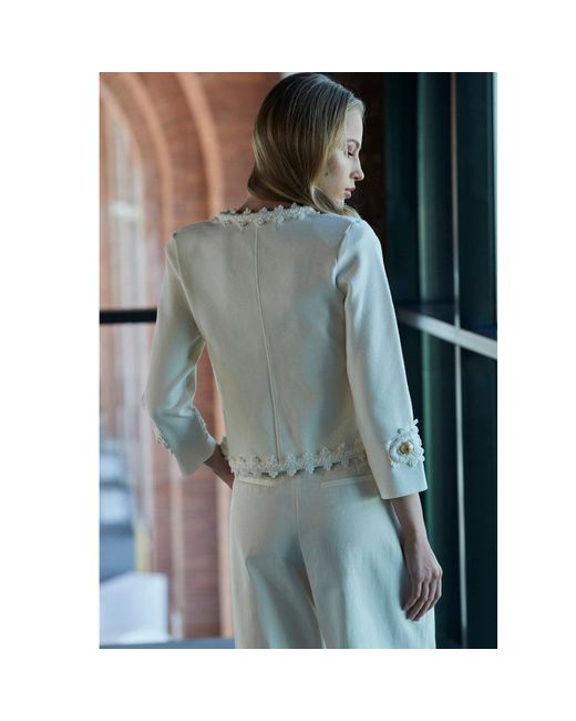 The Extreme Collection White Ivory Cropped Jacket With Textured Floral Embellishments And-Tone Buttons René