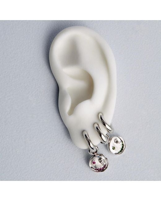 Kasun Metallic Smile Hoop Earrings – December – Tanzanite –