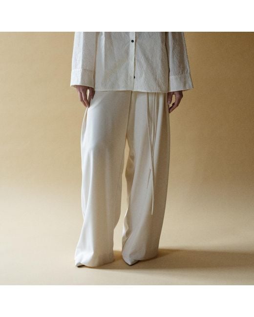 Una Berzina Natural Neutrals Ivory Wide-Leg Trousers With Asymmetrical Closure