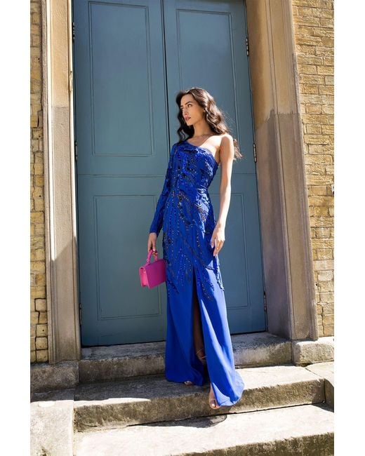 Raishma Blue Astrid A One Shoulder With A Dramatic To-The-Floor Draped Georgette Train, Falling From The Shoulder Gown