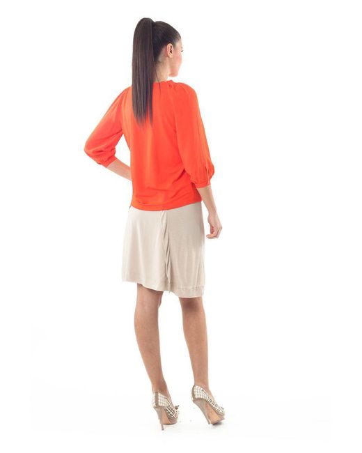 Conquista Orange Ruffle Neck Top