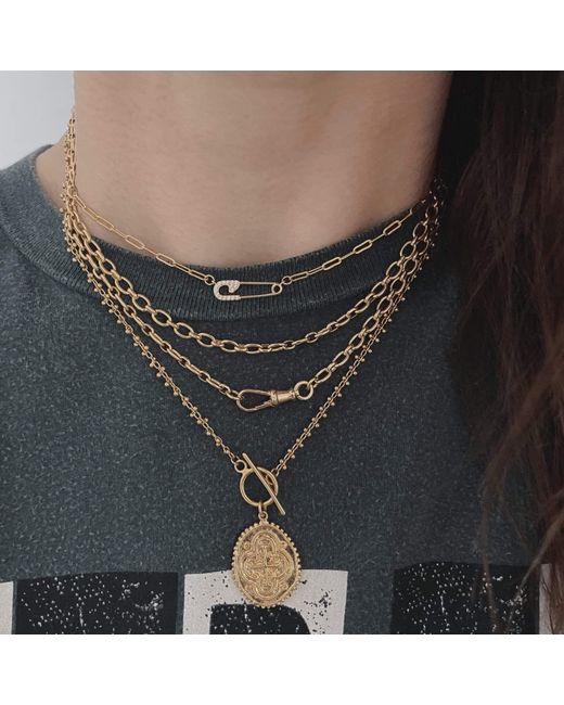 IN CAUDA VENENUM Metallic Lakshmi Necklace