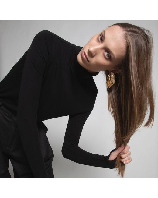 Una Berzina Black Turtleneck