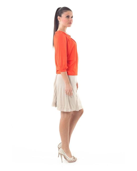 Conquista Orange Ruffle Neck Top
