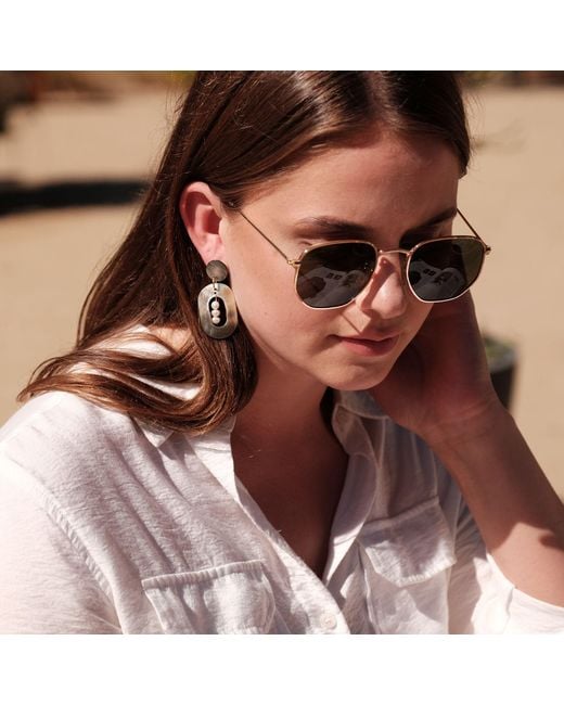 LIKHÂ Black Oval Earrings With Inner Pearls