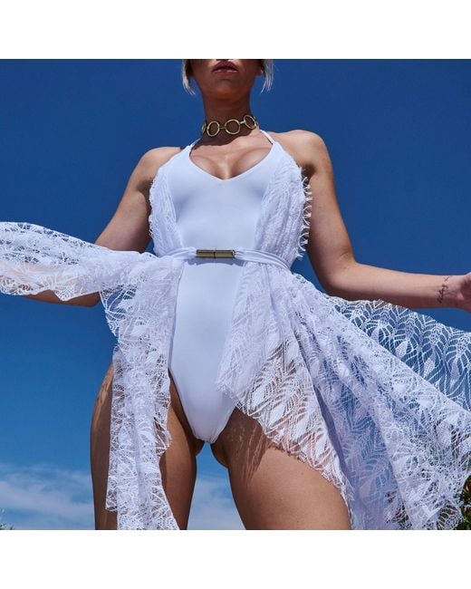 ANTONINIAS White Sumptuous Deep V One-Piece Swimsuit With Side Lace Detail And A Belt