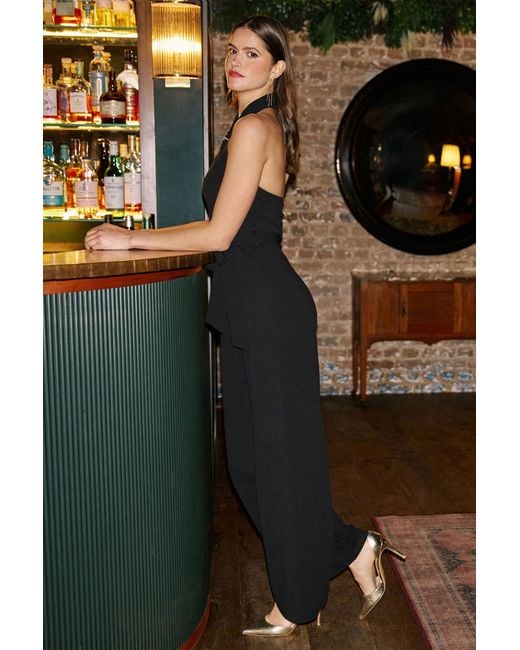 Yumi' Black Cross Over Halter Neck Jumpsuit
