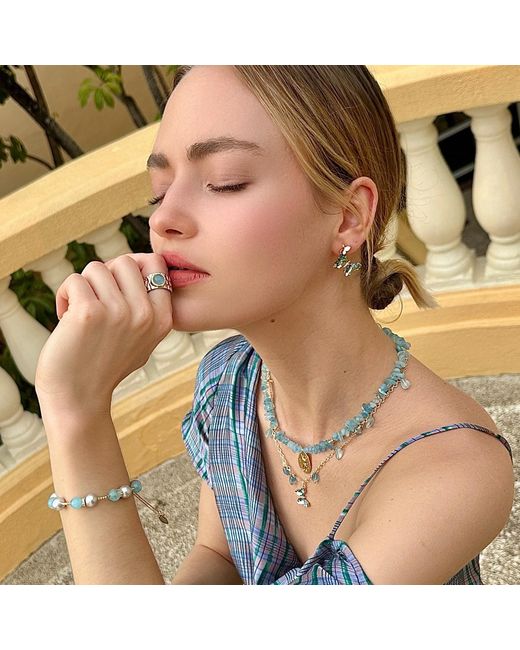 Farra Metallic Aquamarine Charms With A Butterfly Pendant Necklace