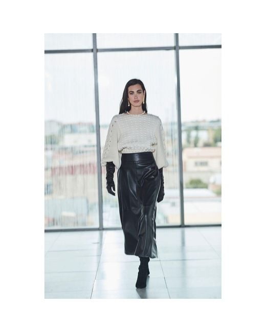 The Extreme Collection Black Jet Faux Leather Skirt Midi With Sleek Silhouette And Statement Style