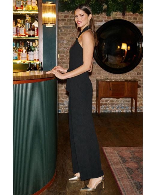 Yumi' Black Cross Over Halter Neck Jumpsuit