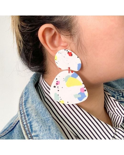 By Chavelli Yellow Paint Splatter Dangly Earrings