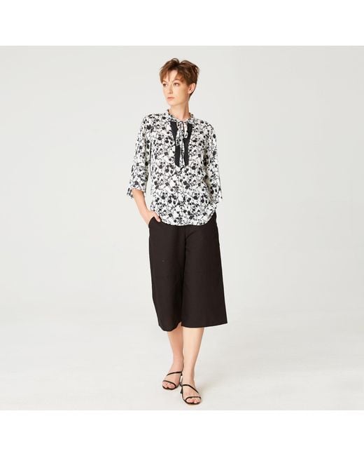 Smart and Joy Black Tulip Sleeves Blouse With Monochrome Floral Print