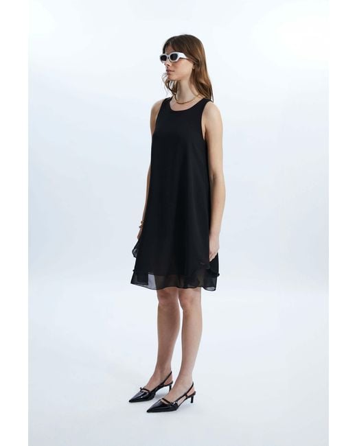 James Lakeland Black Sleeveless Wave Hem Dress
