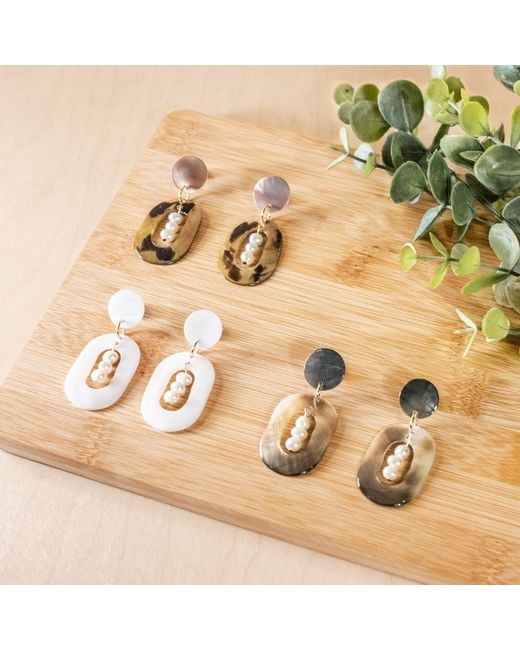 LIKHÂ Black Oval Earrings With Inner Pearls