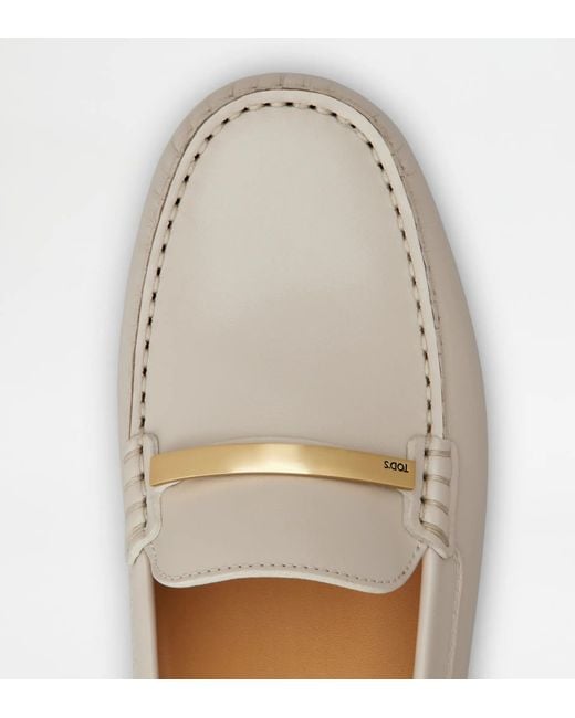 Tod's White "Gommino" Loafers