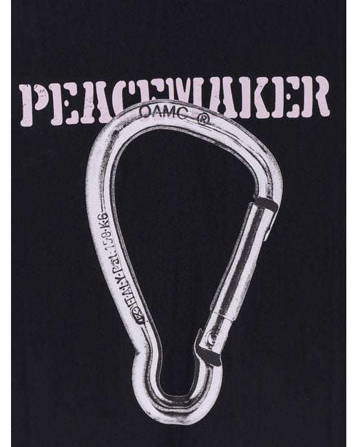 Oamc Peacemaker Black Cotton T-Shirt With Carabinier Print for men
