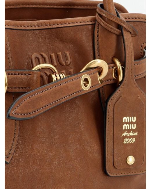 Miu Miu Brown Aventure Leather Handbag With Embossed Lettering Logo