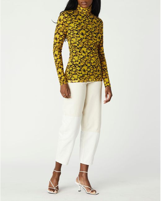 yellow turtleneck top
