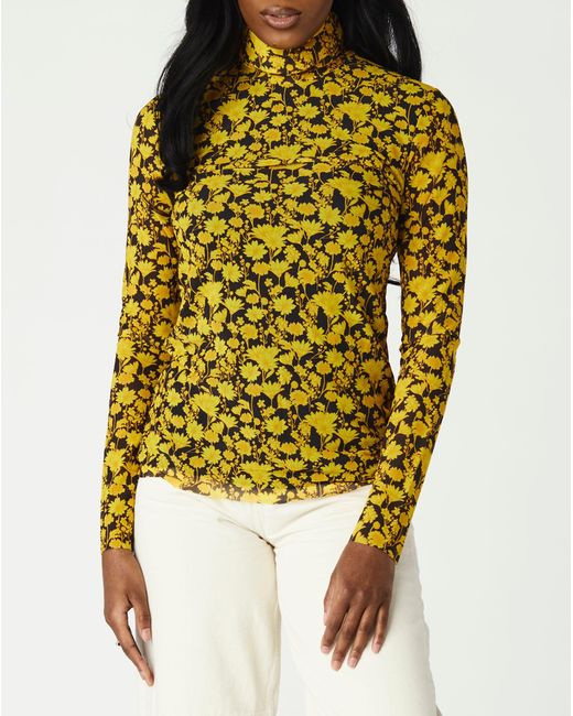 yellow turtleneck top