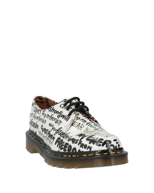 Stringate di Dr. Martens in White