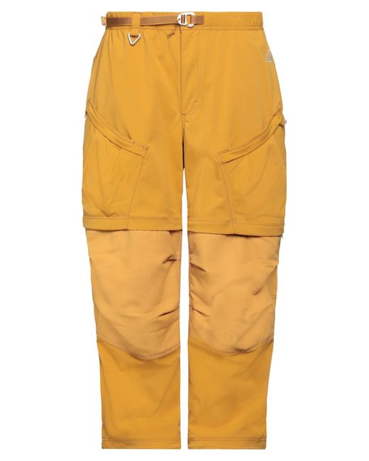 Nike yellow trousers hotsell