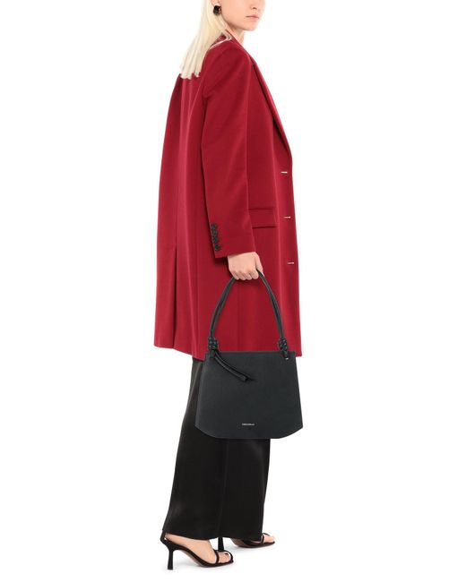 coccinelle black leather bolsa