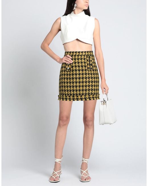 5 PROGRESS Yellow Mini Skirts