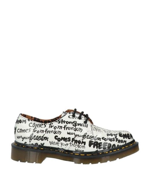 Stringate di Dr. Martens in White